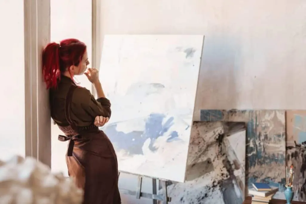 Young creative woman artist standing