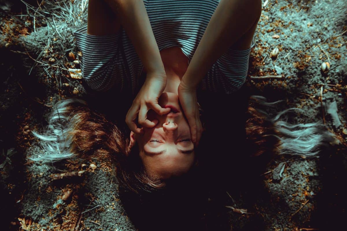 Woman lying on ground